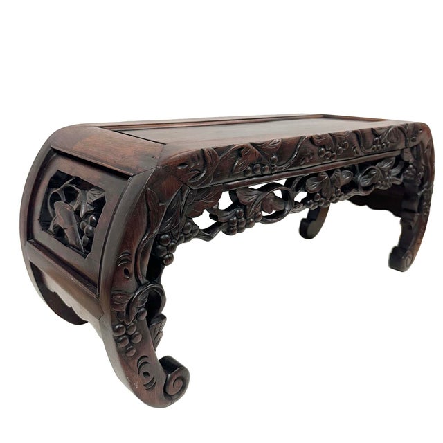 This is an antique Chinese hardwood low table, traditionally referred to as a Kang table (Kangzhuo) or an opium table....