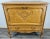 This elegant Vintage French Louis-style bureau cabinet showcases exquisite craftsmanship and refined detailing. The...