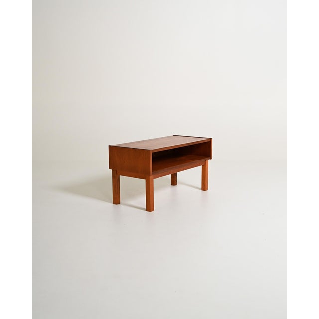Rectangular teak coffee table with open compartment open at the front. Scandinavian production, 1960s. Dating back to the...
