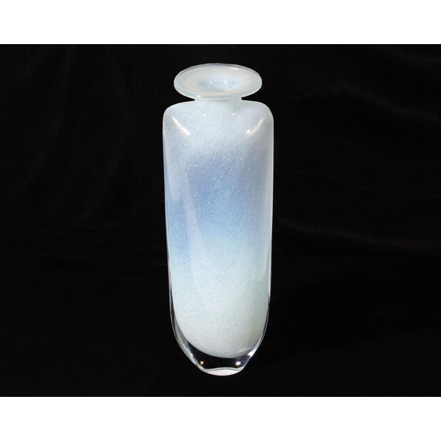 A "Swing" vase designed by the Swedish artist and designer Kjell Engman (born 1946) for Kosta Boda. This vase features a...