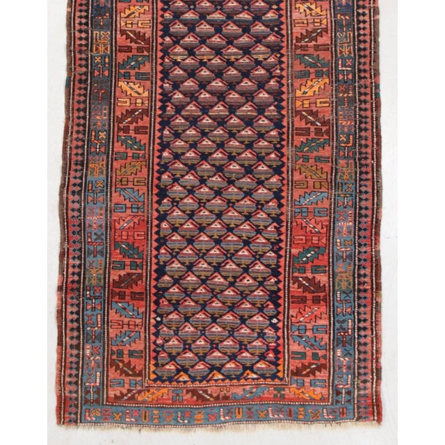 This lovely antique West Persian Kurd runner measures 3.10 x 10.5 ft.