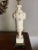 A vintage white Italian alabaster marble table lamp, with carved details on the top, a turned classical urn shape in the...