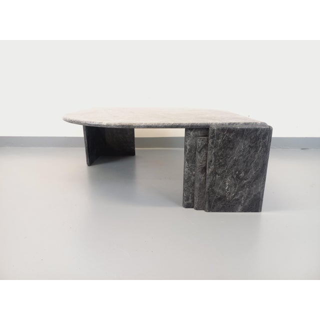 Vintage 1970s coffee table in beautiful marble with striking veining in shades of gray, dark gray, and white. It features...