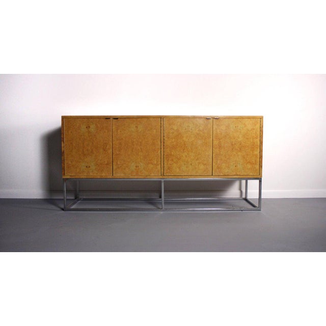 In the manner of Milo Baughman an Exquisite Bernhardt burl wood credenza on a handsome chrome base Gorgeous burl wood on a...