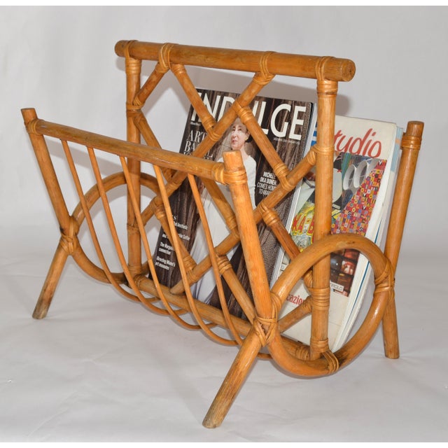 1970s Mid-Century Modern Boho Chic bend Bamboo and Caning Magazine Rack or Newspaper Stand. In good vintage condition with...