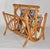 1970s Mid-Century Modern Boho Chic bend Bamboo and Caning Magazine Rack or Newspaper Stand. In good vintage condition with...