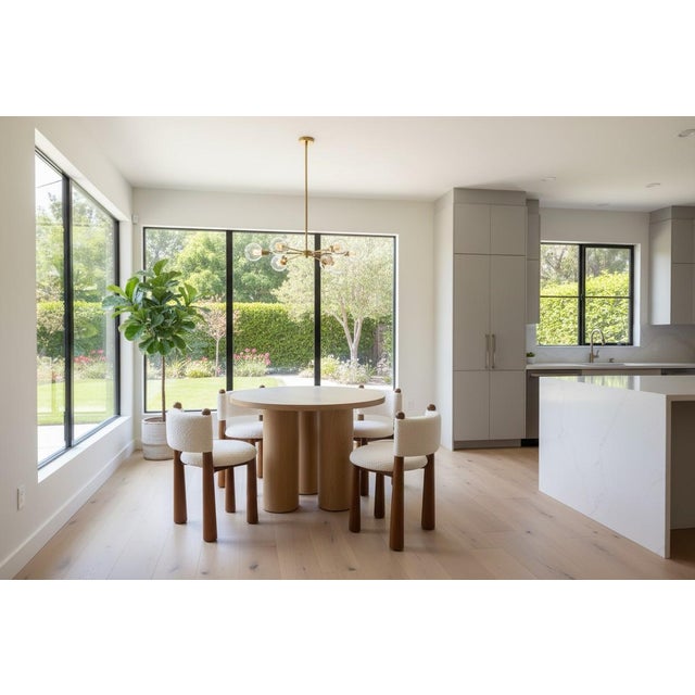 This small space 42" wide dining table set features a modern wood top dining table with 3 strong column legs, and 4 white...