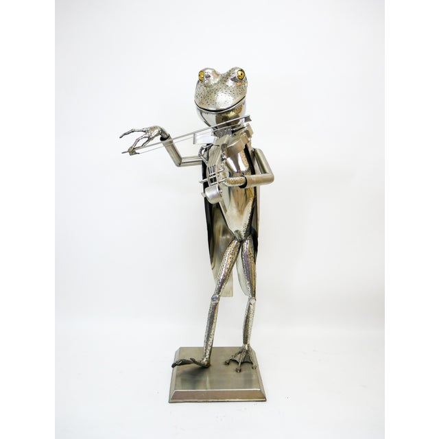 Whimsical welded frog sculpture by noted folk artist James Sauer. Made of steel and brass, this piece is completely eye-...