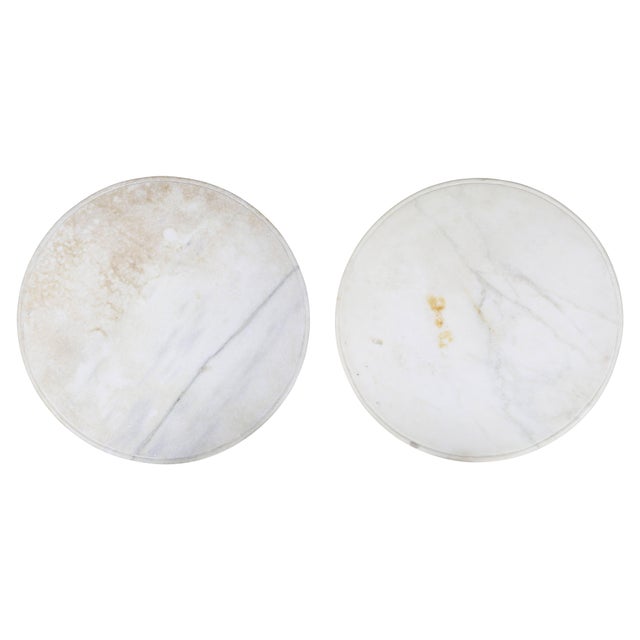 Each candle stand has a circular white marble top over a frieze with leaf tip, rosette and bead and reel carving,...