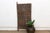 This is a door that gets people talking the moment they notice it: two of its carved figures are riding bicycles, mid-...