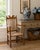 A beautifully preserved early 19th century New England armchair, handcrafted in maple and ash with a woven rush seat and...