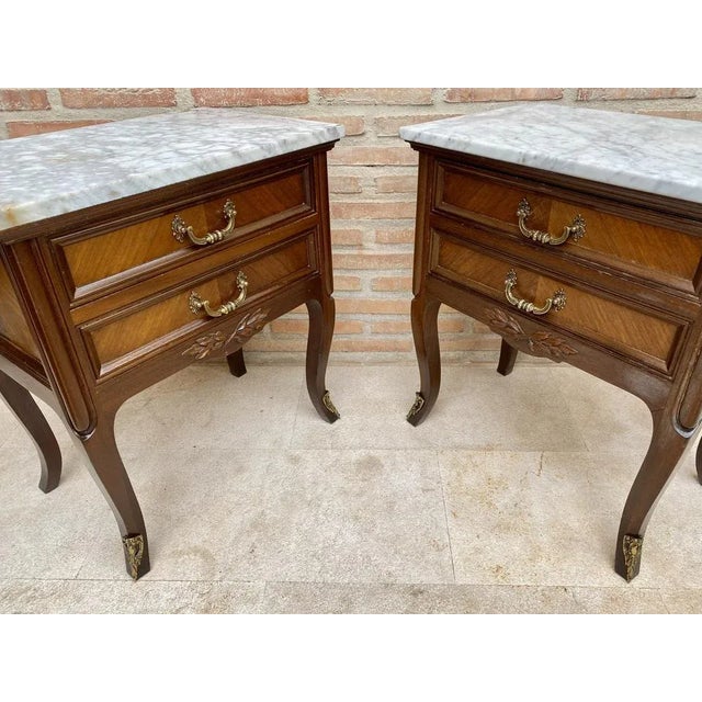 We are delighted to introduce this pair of French walnut nightstands. The front drawers have this beautiful burr in the...