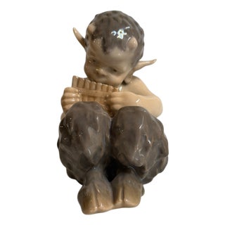 Ceramic Figurine of Little Faun Playing a Musical Instrument from Royal Copenhagen, 20th Century For Sale