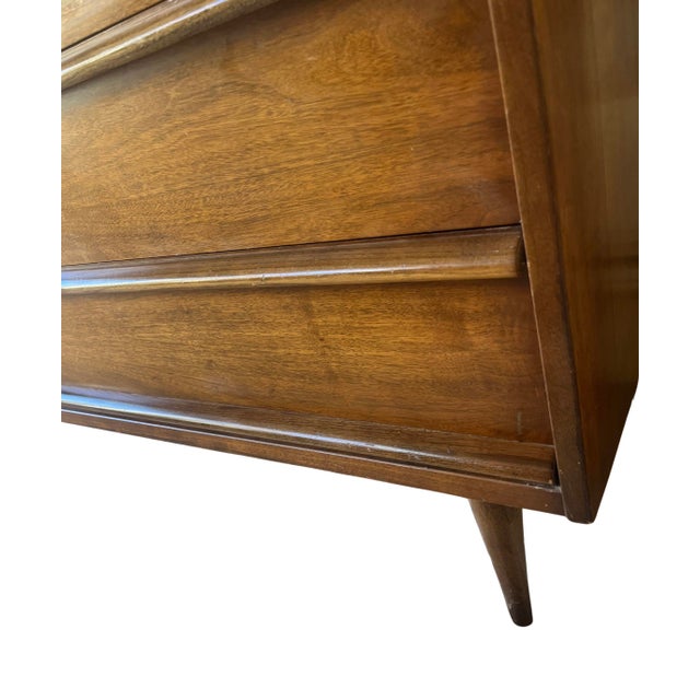 Vintage Bassett credenza with three drawers and a cabinet. Measures 48” long by 17.75” deep by 30” tall. Cabinet closes...