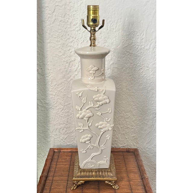 Beautiful midcentury blanc de chine table lamp with brass footed base. Please see condition details noted. Most items...