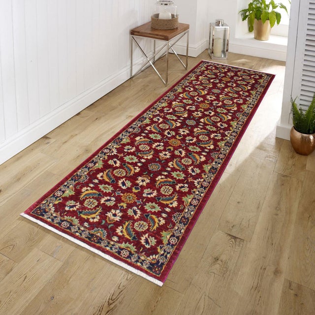 Enhance the ambiance of your home with this magnificent Persian-influenced Turkish hand-knotted rug made by skilled...