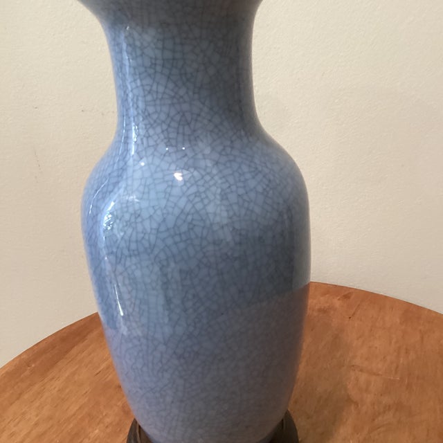 The Vintage Chinese Blue Crackle Glaze Porcelain Vase on Wood Base is a stunning piece of Asian antique artistry. Made in...