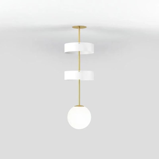 Short circles and globe pendant light by atelier areti dimensions: d 25 x w 25 x h 86.5 cm. Materials: brushed brass,...