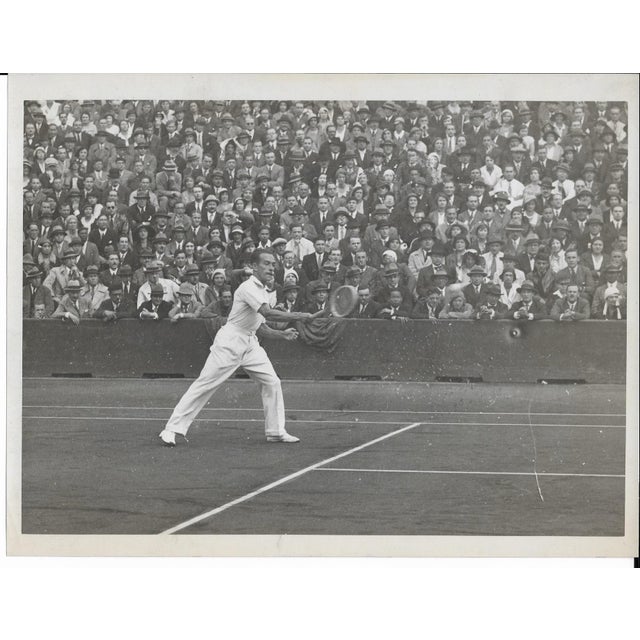 1940s black and white photograph of Earl Cochell (1922-2019) playing, possibly at Wimbledon in 1949 or the US Open around...