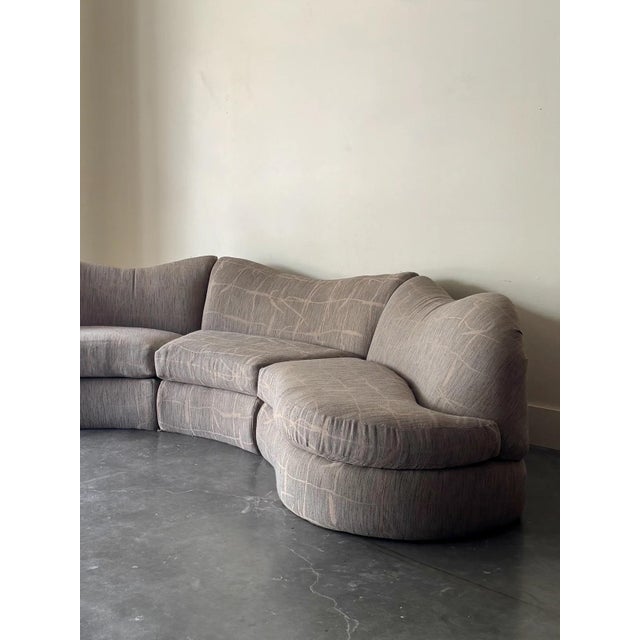 In its original textured abstract fabric with hues of grey and beige. 3 pieces and has been professionally cleaned with...