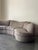 In its original textured abstract fabric with hues of grey and beige. 3 pieces and has been professionally cleaned with...