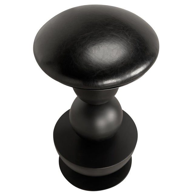 This sculptural swivel counter stool features a bold geometric design comprising stacked symmetrical shapes: a dome,...