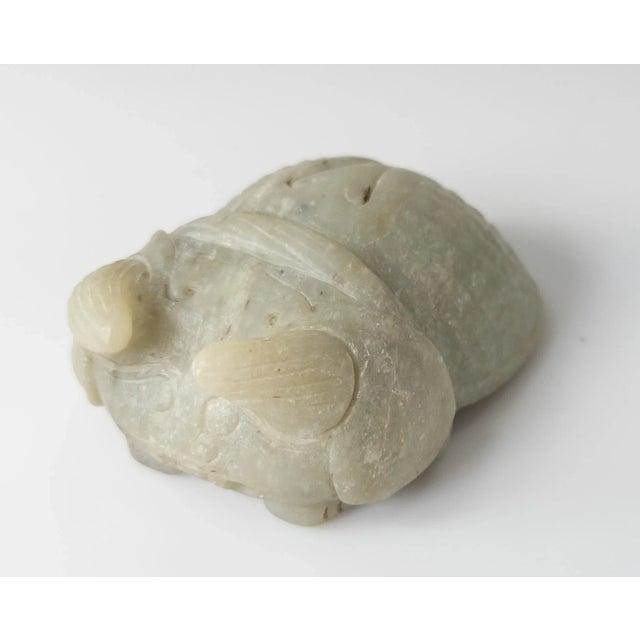 We are selling this 20th century Chinese carving in Archaistic style of a Cicada bug carved from a pale green to gray...
