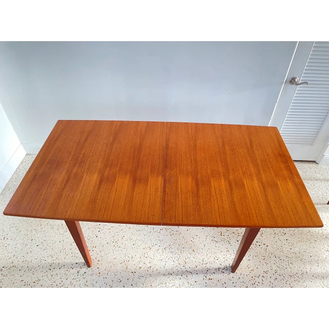 French Mid-century extended table with 2 leaves at 17 inches each, table 65.1 inches extend to 99.1 inches long.