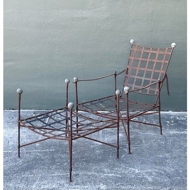 Discover a rare fusion of industrial chic and sculptural artistry with this exceptional Vintage Lounge Chair and Ottoman...