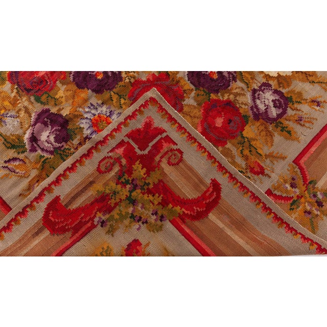 This early 20th-century Russian Bessarabian flat-weave rug, circa 1900, is a remarkable textile masterpiece that exudes...