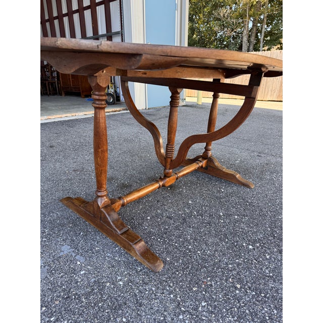 This item is an antique French oval "vigneron" or wine tasting table, likely dating back to the mid 19th century and...