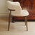 This stylish designer chair is a newly produced piece of seating furniture with a fully upholstered body consisting of a...