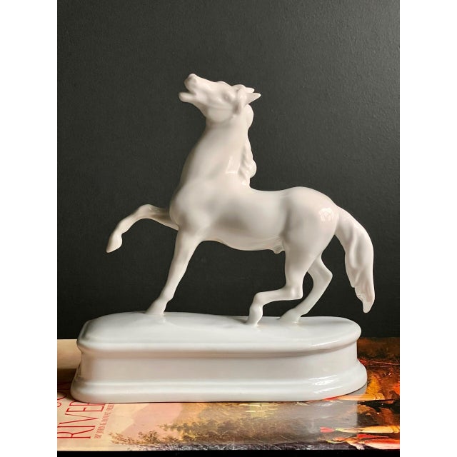 1960s hand-painted white porcelain sculpture of a rearing horse by Herend Hungary. It features a crisp, creamy white Blac...