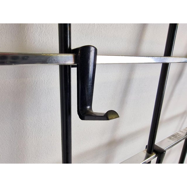 Mid-Century modular wall mounted coat rack with hat storage. The hooks can be positioned as desired. Beautiful modernist...