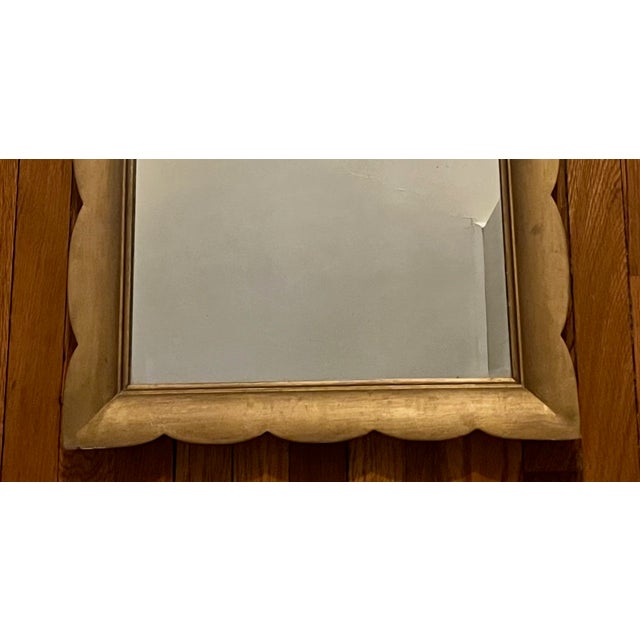 Cute scalloped mirror, large enough to stand on its own or to be mixed into a gallery wall. Nice patina and age.