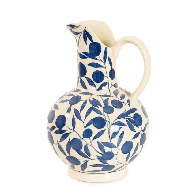 Bold and timeless, the Olivia Water Pitcher features a deep blue leaf pattern hand-painted over a creamy base. Its...
