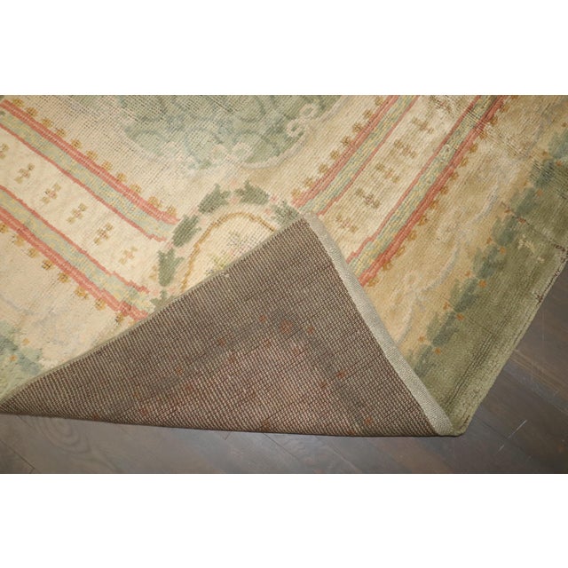 A square size Irish Donegal Rug in mint green from the early 20th century Details rug no. 10786 size 11' 9" x 11' 11" (358...
