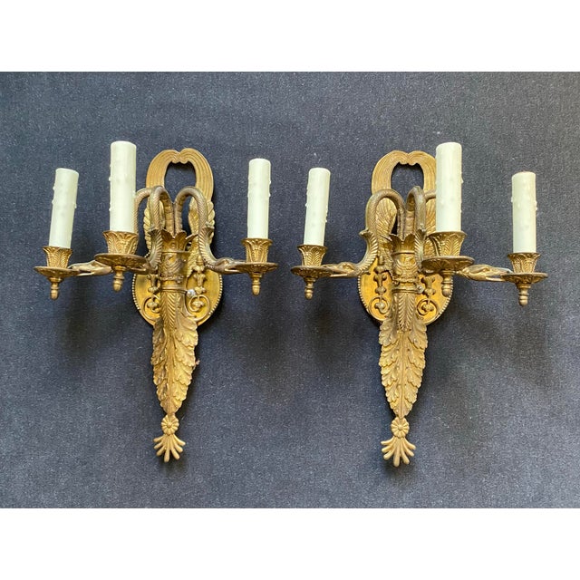 The Splendor of a Matching Pair of Antique Brass Sconces There's a certain allure that comes with a matching pair of...