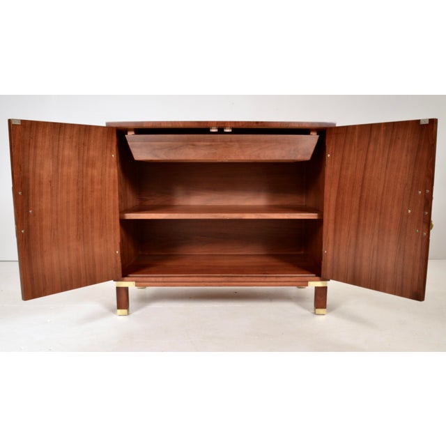 Handsome cabinet featuring banded walnut and teak, newly restored with a rich stain and satin lacquer finish. Hardware...