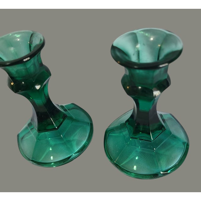Elevate your home decor with the vintage charm of this emerald, green candlestick set, crafted by the renowned Indiana...