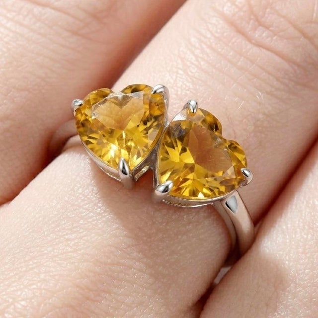 Radiating warmth and charm, this elegant Dual Heart Citrine Ring is a beautiful symbol of love, joy, and positive energy....
