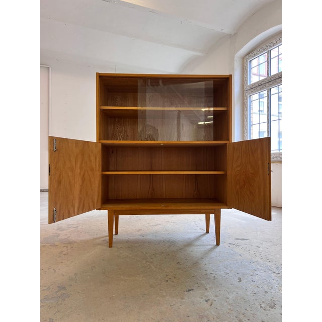 This bookcase from the legendary 602 series (model 602/D) is an absolute masterpiece of German post-war design, created by...