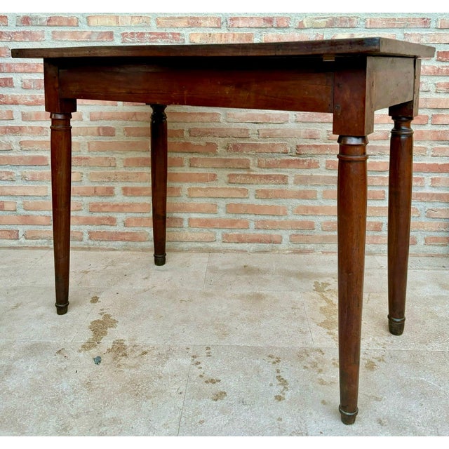 Handcrafted from solid oak wood, richly detailed original antique character including a rectangular top, rising on turned...