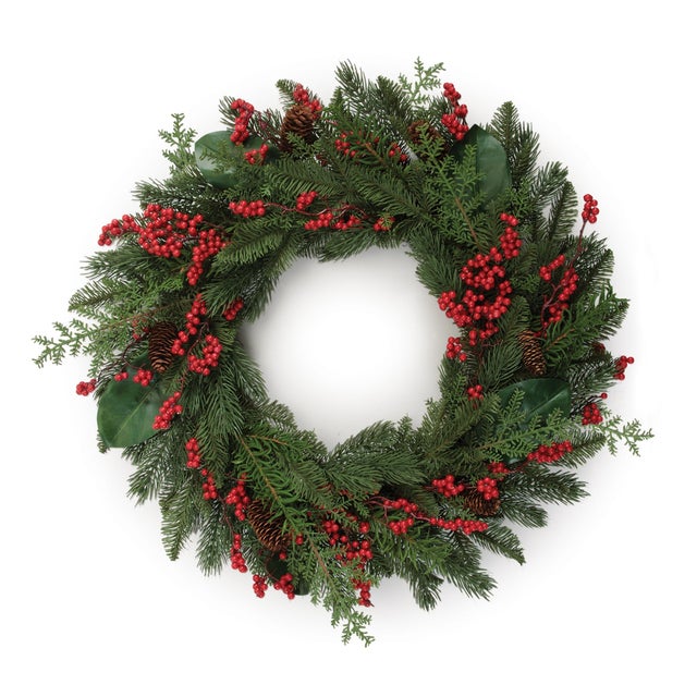 Celebrate the season with the timeless beauty of this Pine and Red Berry Wreath. Designed with lush evergreen branches,...