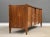 A mid century modern walnut nine drawer dresser with sculpted walnut details and brass knobs. Circa 1960’s. Made in USA....