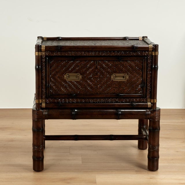 Handsome pair of British colonial style stands crafted in mahogany in faux bamboo with a one drawer case having...