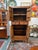 Design Plus Gallery presents a Vintage Chinese Elm Two-Tier Cabinet. Constructed from elm, this tall cabinet showcases...