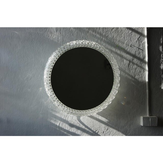 Large mirrored lamp produced by Glashütte Limburg - cataloged in a 1970s copy. The mirror is surrounded by crystal glass...