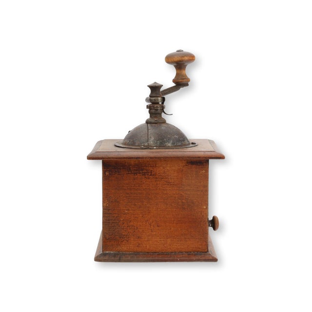 Early 20th century French Peugeot Frères coffee grinder in warm patinated wood with iron crank handle and original brass...