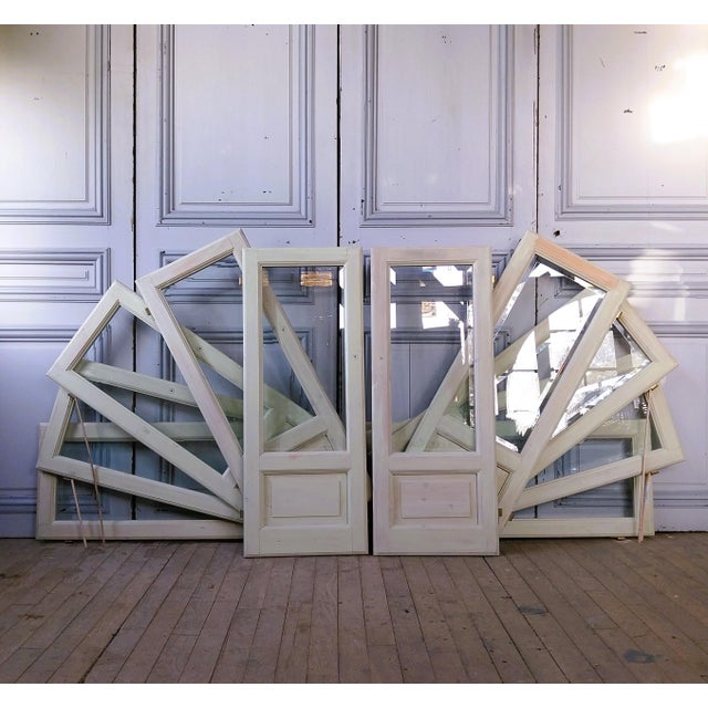 Set of 7 pairs of glass display doors. The pine frame is ready to be painted. The beveled glass panes are set in glazing...